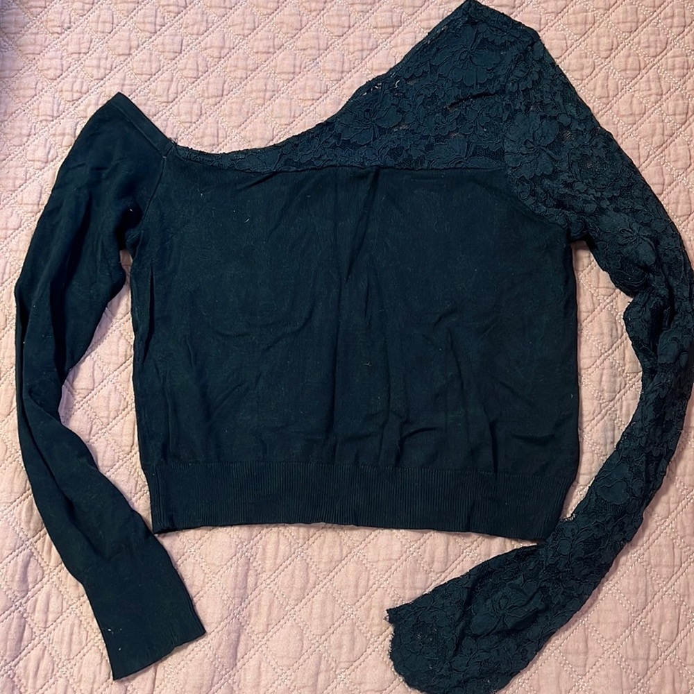 Express black top with one lace sleeve.